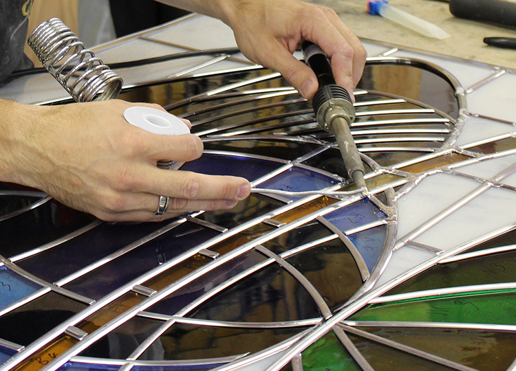 Glass Maker working on Stain-glass Project 